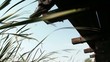 Businessman Hanging Feet Over Edge