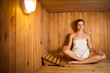 Young woman relaxing in a sauna