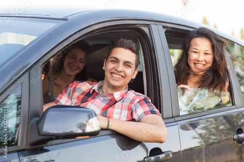 Photo: Boys and Girls in a Car Leaving for Vacation Boys and Girls in a Car Leaving for Vacation