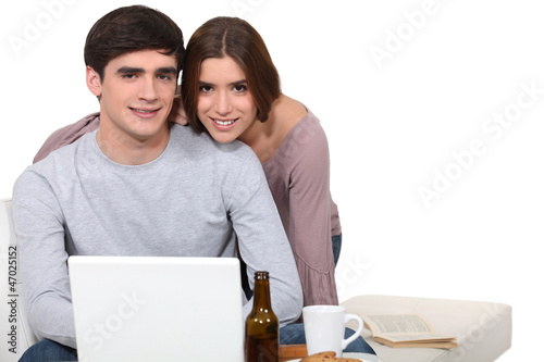 Photo: Young couple surfing the Internet Young couple surfing the Internet