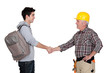 Builder shaking apprentice's hand