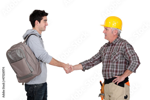 Photo: Builder shaking apprentice's hand Builder shaking apprentice's hand