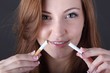 Photo: woman and stop smoking cigarette (focus on cigarette) woman and stop smoking cigarette (focus on cigarette)