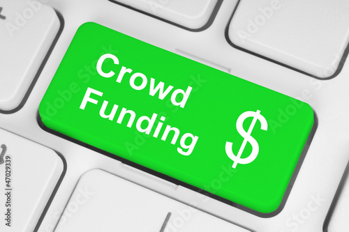 Illustration: Green crowd funding button on keyboard Green crowd funding button on keyboard