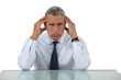 Senior businessman with headache
