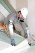 Photo: Man installing wall panels Man installing wall panels