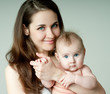 Young mother hugging baby
