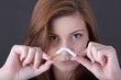 Photo: woman and stop smoking cigarette (focus on face) woman and stop smoking cigarette (focus on face)