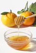 Photo: Honey and Mandarins isolated on white Honey and Mandarins isolated on white