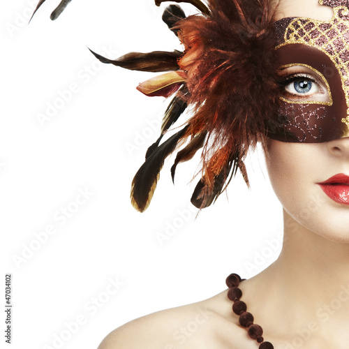 Photo: Beautiful young woman in brown mysterious venetian mask Beautiful young woman in brown mysterious venetian mask