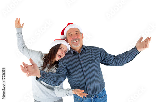 Photo: Opa und Enkelin mit Weihnachtsmützen Opa und Enkelin mit Weihnachtsmützen