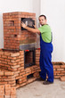 Worker building a masonry heater