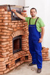 Worker building a masonry heater