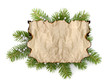 Photo: Old parchment paper with copy space on Christmas tree branch bac Old parchment paper with copy space on Christmas tree branch bac