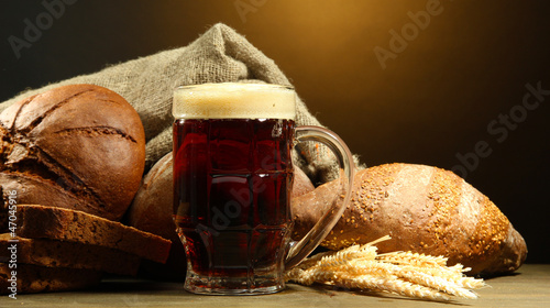 Photo: tankard of kvass and rye breads with ears, tankard of kvass and rye breads with ears,