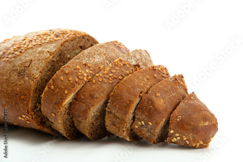 Photo: tasty sliced rye bread, isolated on white tasty sliced rye bread, isolated on white