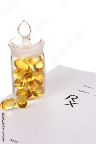 Photo: Capsules in receptacle with prescription pharmacist isolated Capsules in receptacle with prescription pharmacist isolated