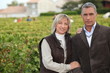 Couple in front of vineyard