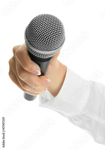 Photo: female hand with microphone isolated on white female hand with microphone isolated on white