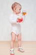 Baby girl with healthy food at home
