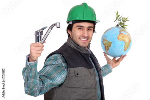 Photo: Plumber with a tap and a globe Plumber with a tap and a globe