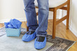 Photo: Standing Person Wearing Booties Standing Person Wearing Booties