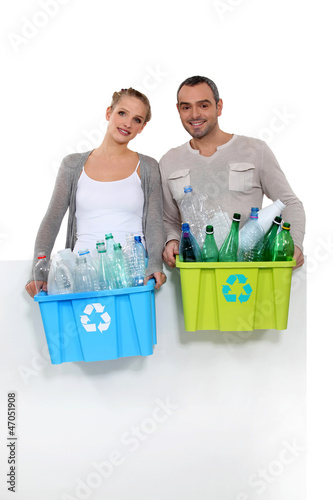 Photo: Couple taking out the recycling Couple taking out the recycling