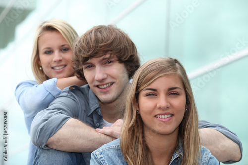 Photo: three students sitting on stairs three students sitting on stairs