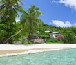 White coral beach sand and azure indian ocean.