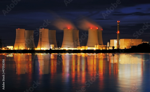 Photo: Nuclear power plant by night with reflection Nuclear power plant by night with reflection