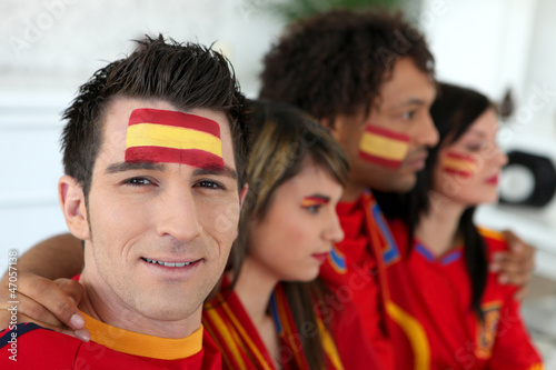 Photo: Two Spanish couples gathered to watch the football Two Spanish couples gathered to watch the football