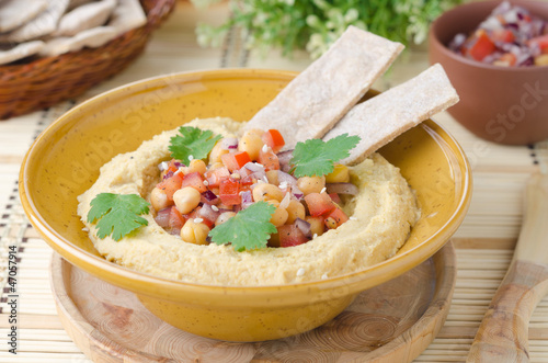 Photo: Hummus with a salad of chickpeas and tomatoes with cilantro and Hummus with a salad of chickpeas and tomatoes with cilantro and