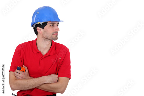 Photo: Builder with a tape measure Builder with a tape measure