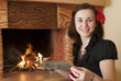 Foto: Woman near fireplace Woman near fireplace