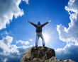 Man on top of mountain.