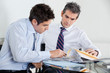 Businessmen Working In Office