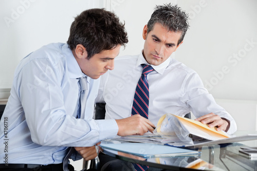 Photo: Businessmen Working In Office Businessmen Working In Office