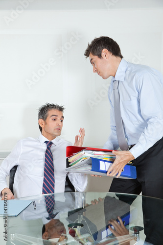Photo: Businessmen Overwhelmed By Load Of Work Businessmen Overwhelmed By Load Of Work