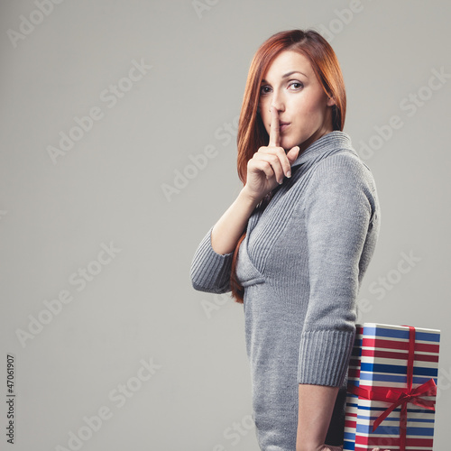 Photo: Beautiful woman with surprise gift Beautiful woman with surprise gift