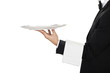 young waiter in work uniformon the white