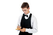 young waiter in work uniformon the white