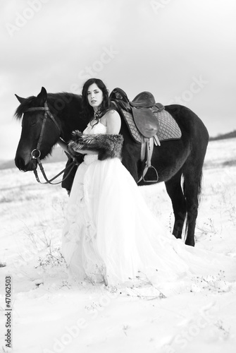 Photo: Bride with a horse in the snow Bride with a horse in the snow