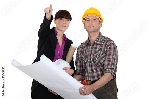 Photo: Architect holding plans Architect holding plans