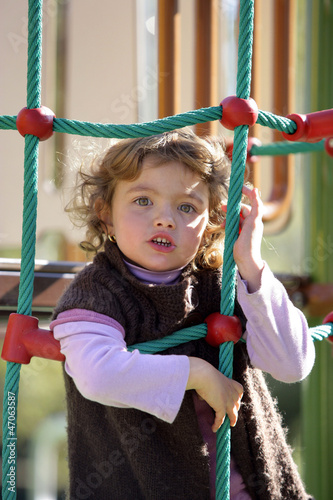Photo: Little girl on a playground Little girl on a playground