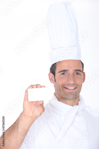 Photo: Chef with a blank business card Chef with a blank business card