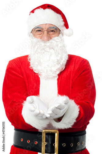 Photo: Bespectacled Father Santa posing with open palms Bespectacled Father Santa posing with open palms
