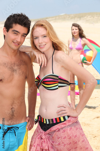 Photo: Teenage couple on the beach Teenage couple on the beach