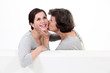 Mother kissing her daughter