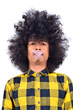 Long-haired young man closing mouth as top secret concept