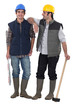 Two manual workers stood together